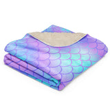 The blanket neatly folded to emphasize thickness, plushness, and material quality.